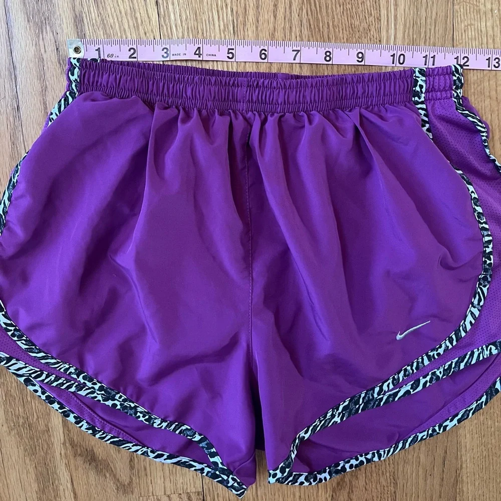 Women’s purple Dri-Fit Nike running shorts with animal print
